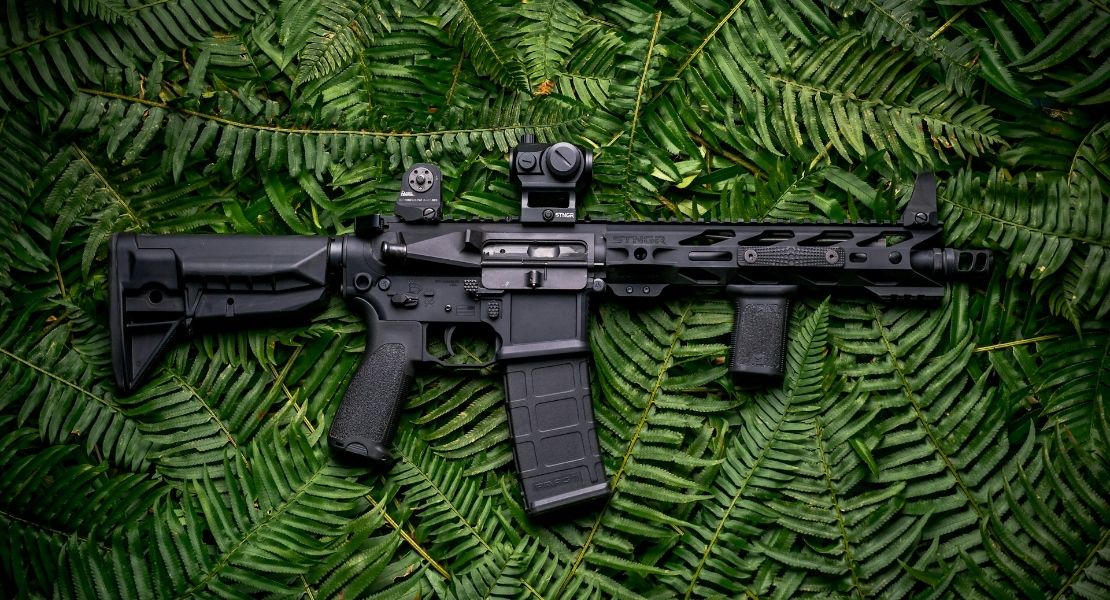 Gun on green textile