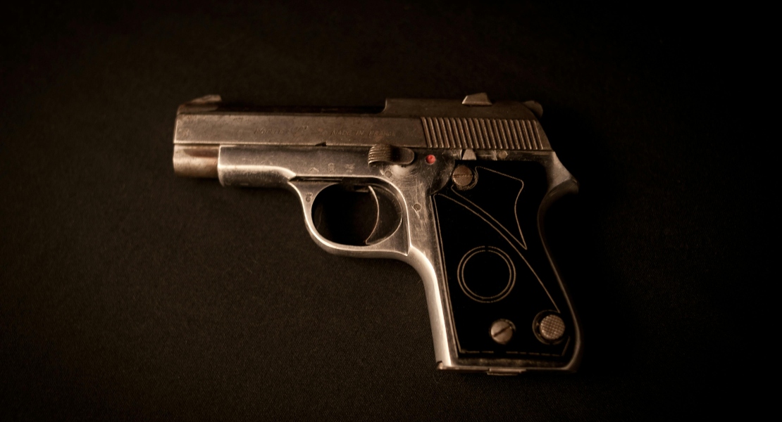 A close-up of gun showing signs of use, an example of what causes firearm wear.