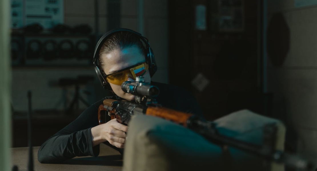 a woman shooting and understanding firearm tolerances