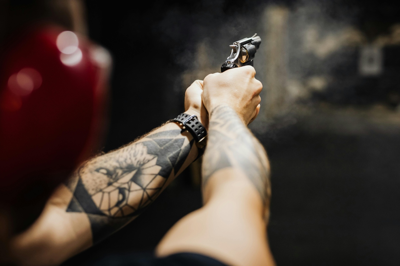a person shooting with gun