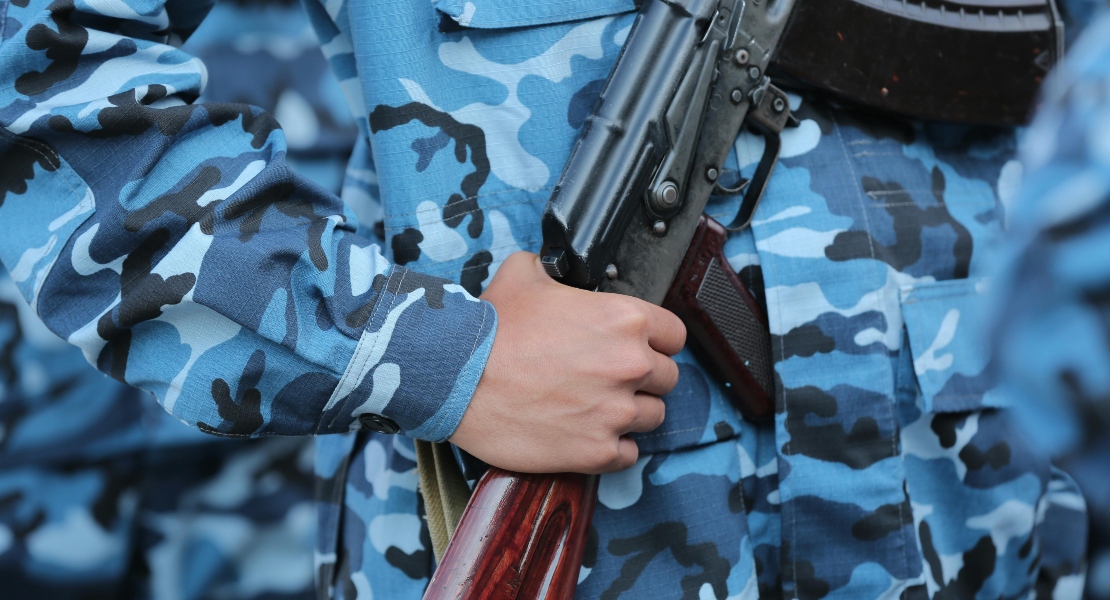 A soldier holding an AK.