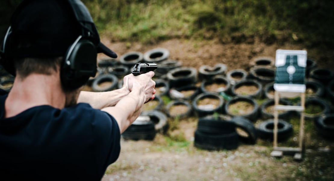 a man shooting outside