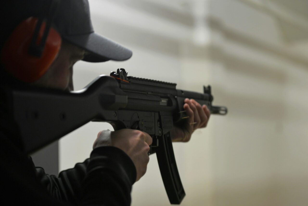 A man shooting from an AR-15.