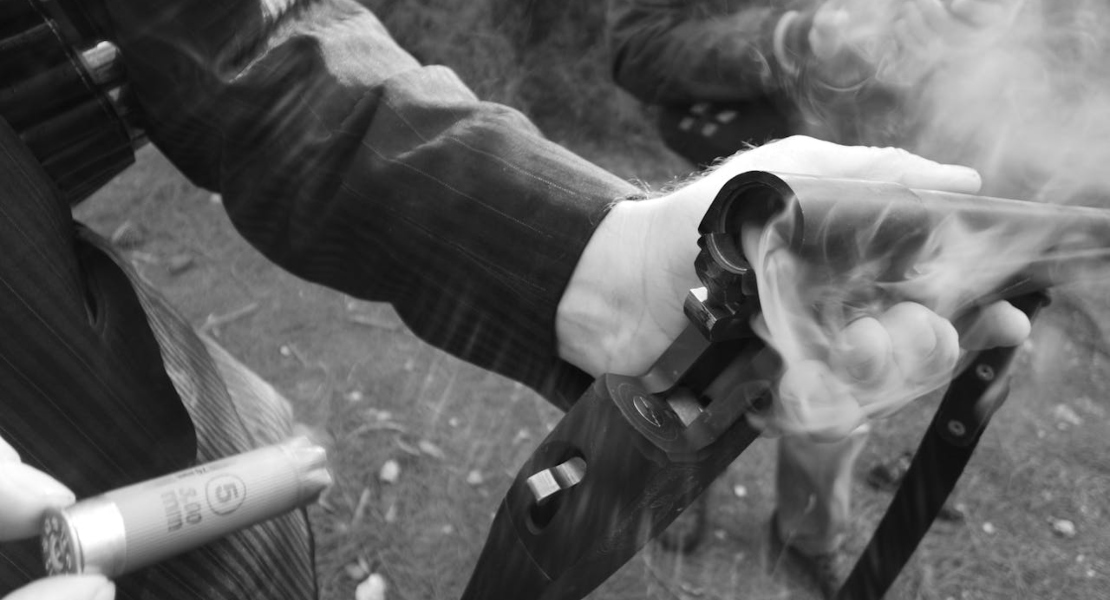 a person releasing a shotgun