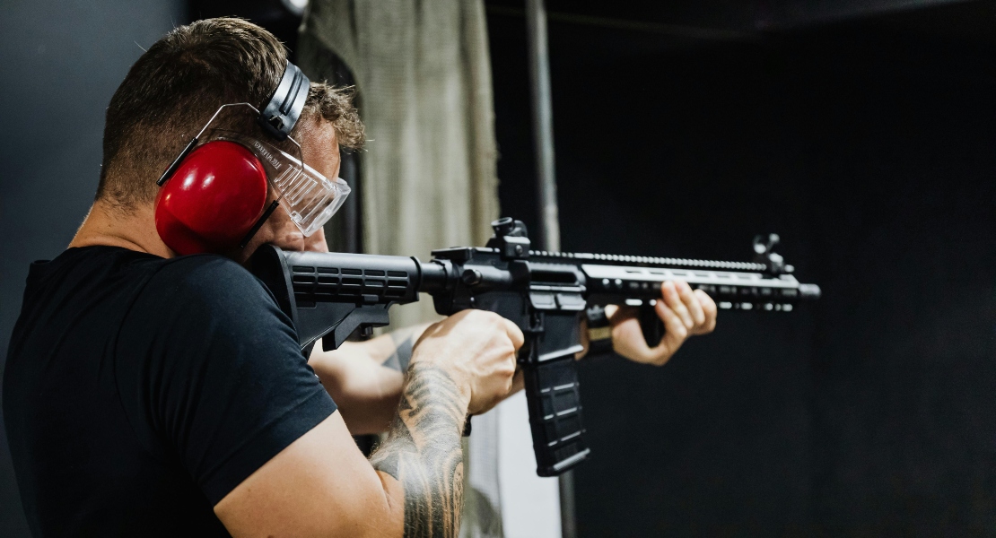 A person shooting from an Ar-15.