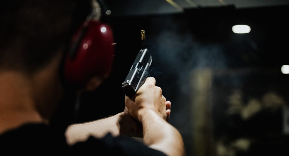a man shooting with a pistol