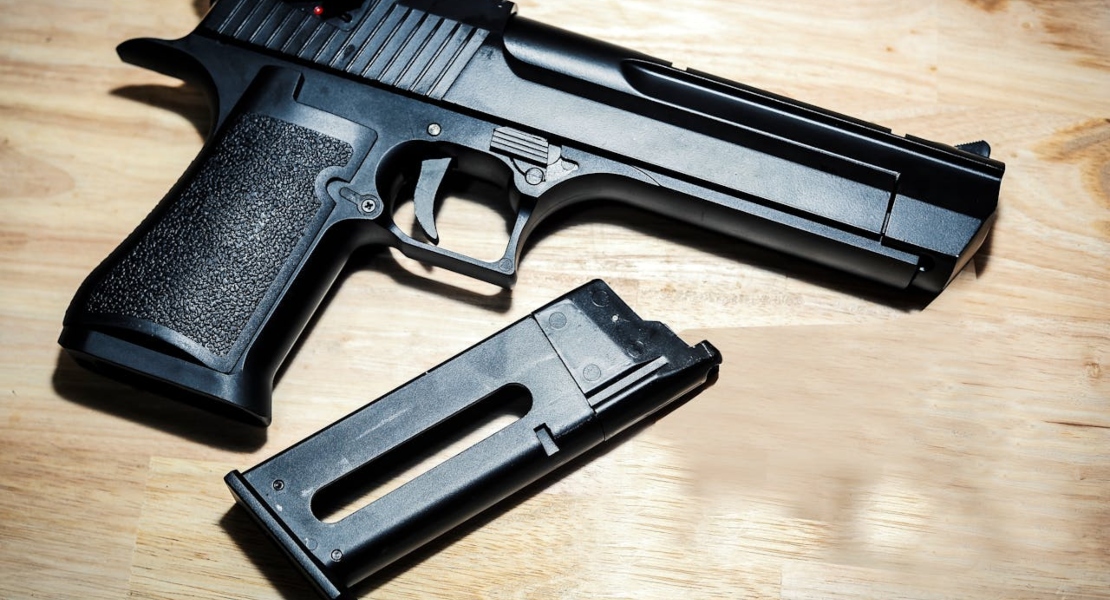 a black gun on the table