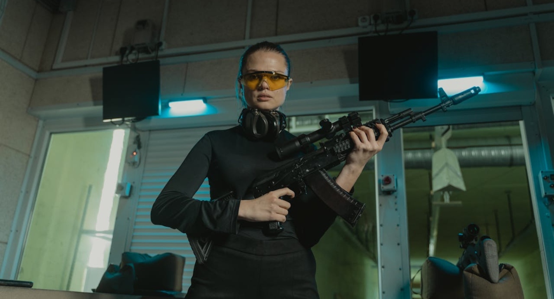 a woman holding a gun