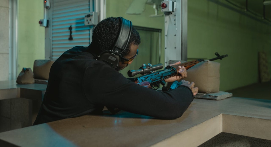 a man holding a rifle