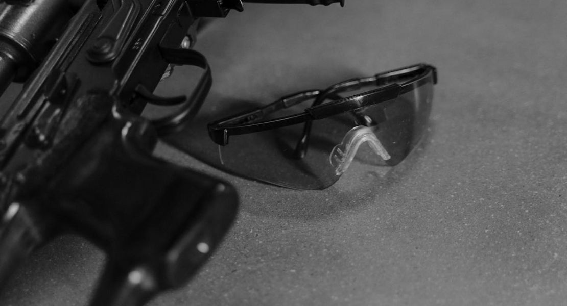 weapon and safety glasses