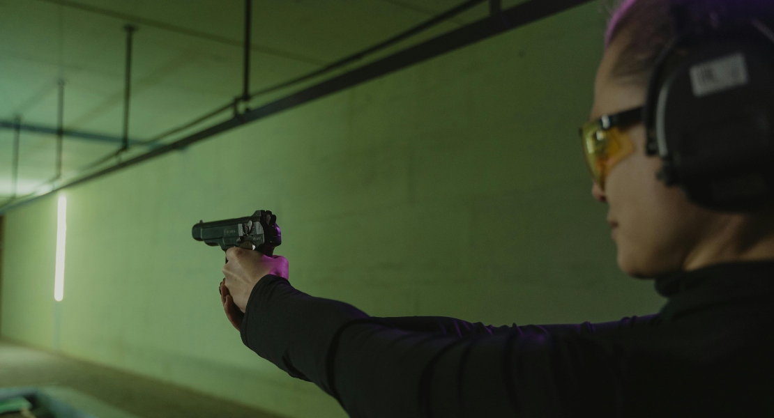 A person dry firing a gun.