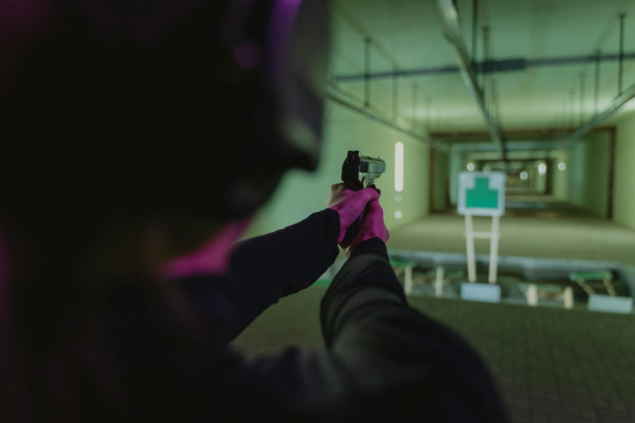a woman shooting and sticking to a Gun Range Etiquette