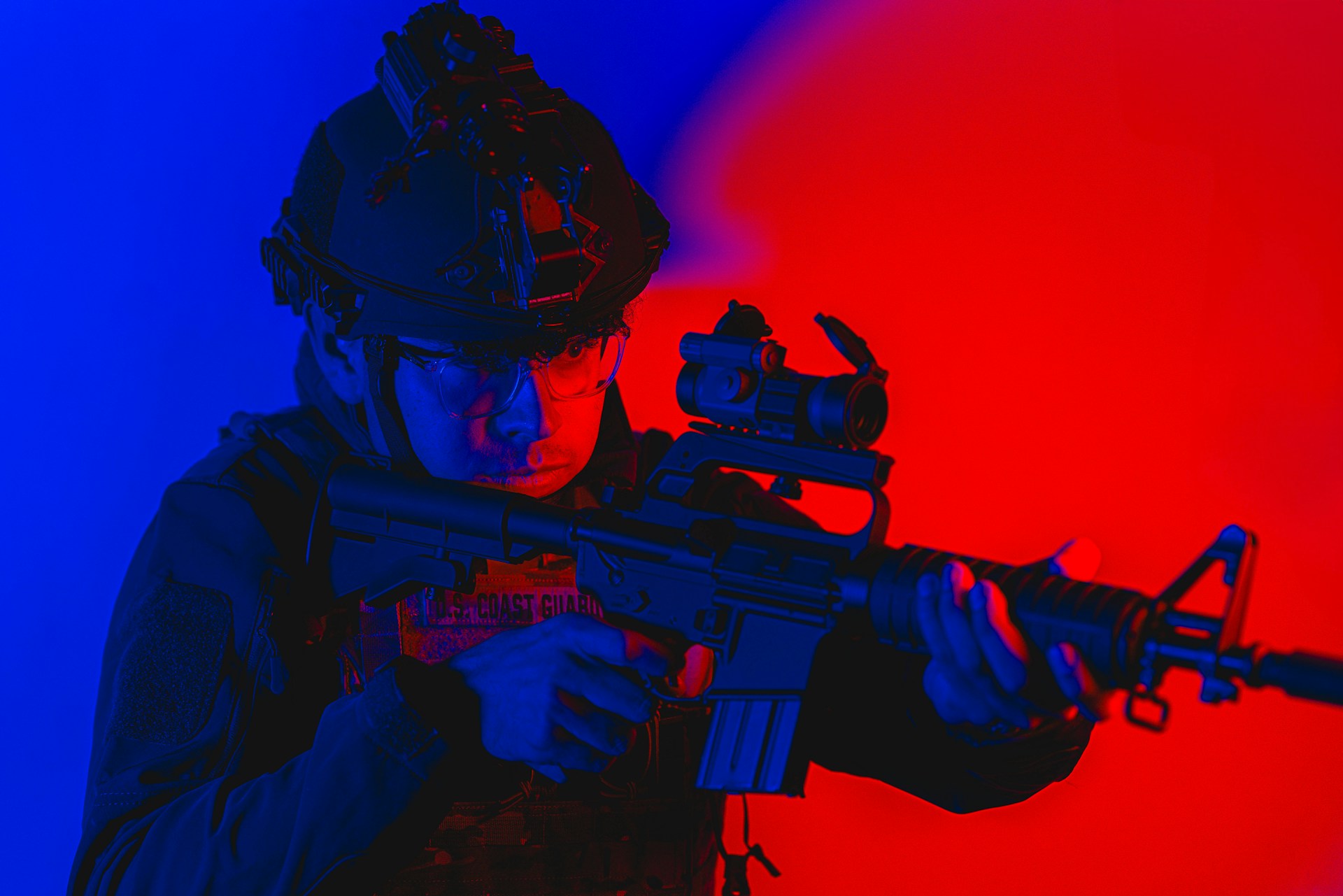 a man in blue and red background contemplating about AR-15 upper vs lower