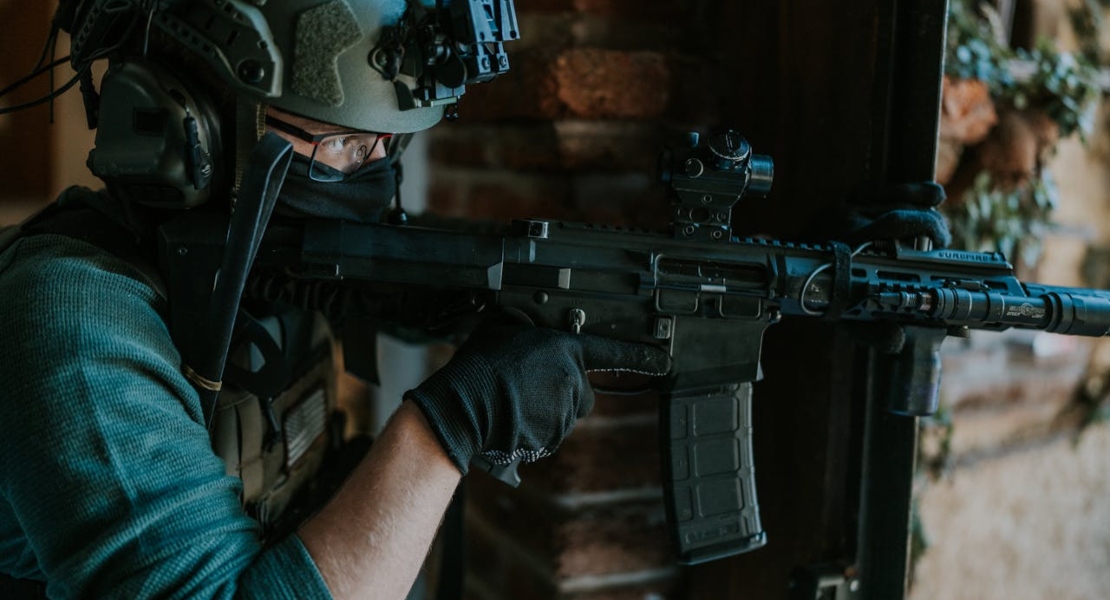 a man holding a rifle