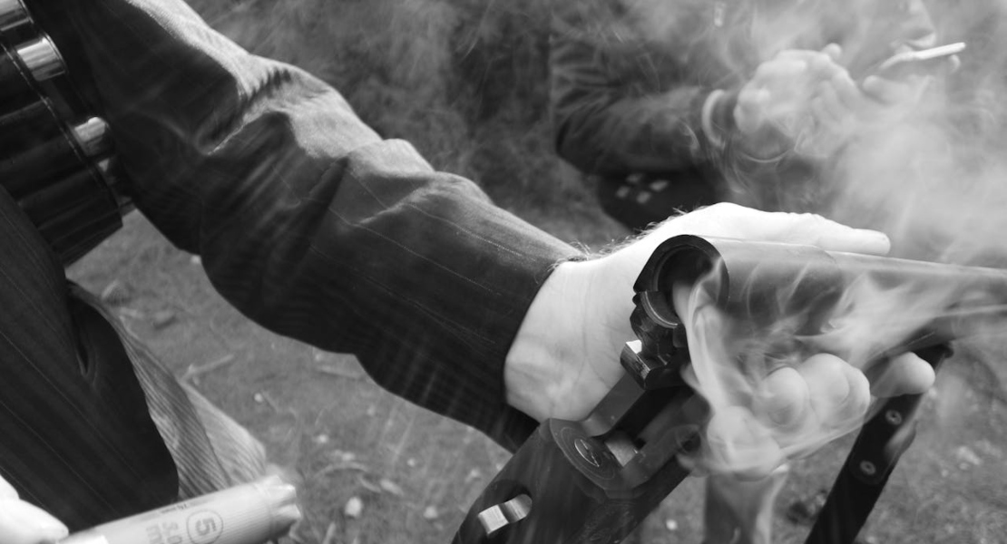 a person releasing a shootgun shell