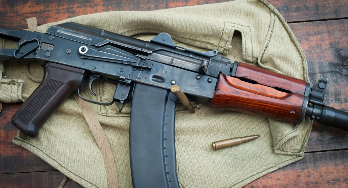 An AK rifle with attached one of the AK magazine types.
