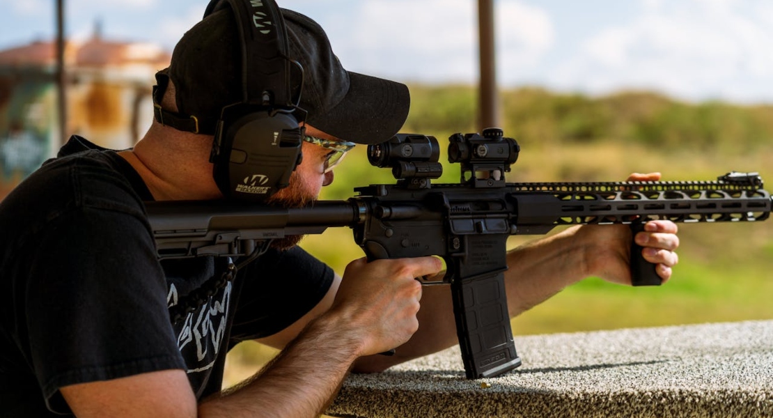a man shooting from a rifle