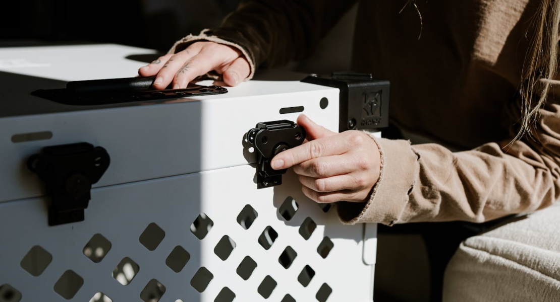 a person closing a suitcase