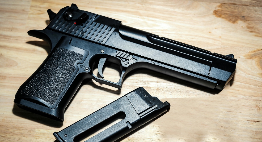 Parkerized firearm coating on a gun with matte non-reflective phosphate finish for rust protection.