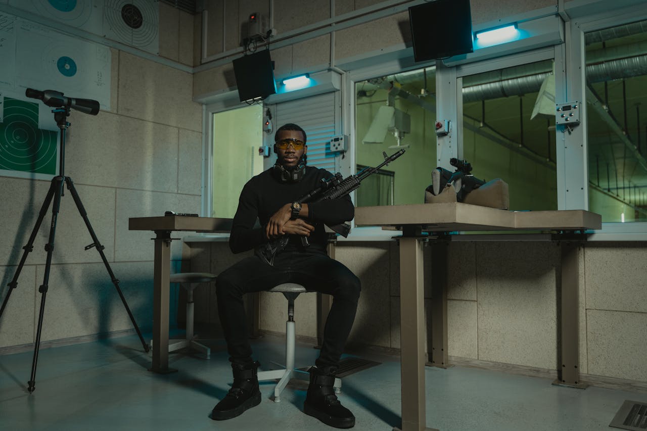 Man holding a rifle illustrating AR-15 vs MP5 comparison in handling, design, and real-world use.