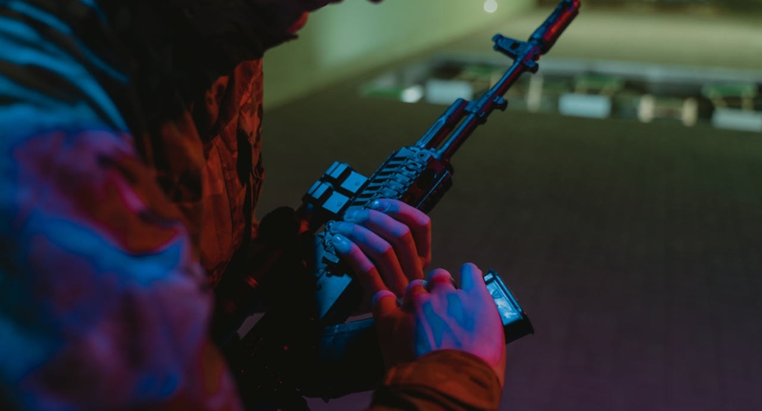 a man holding a rifle