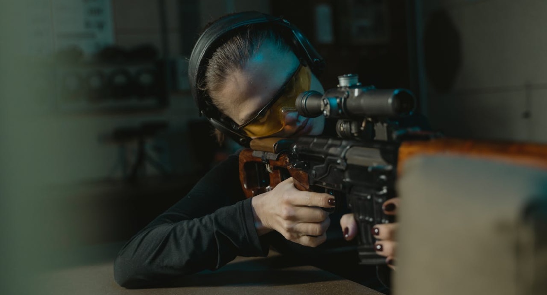 a woman holding a weapon