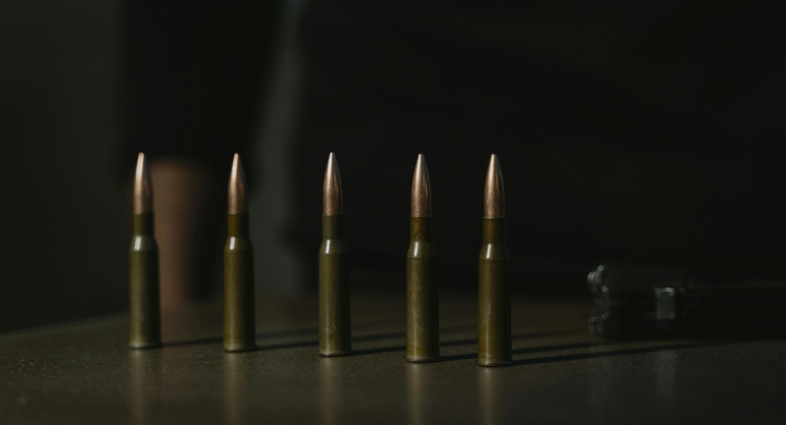 Row of bullets arranged on a table