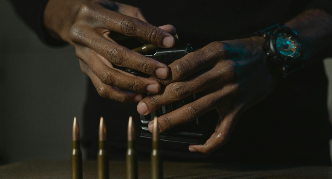 A man loading an AK magazine.