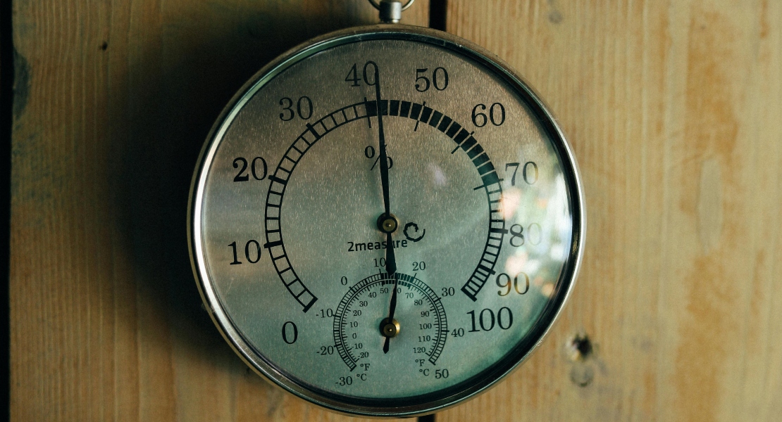 Hygrometer inside a gun safe showing proper gun safe humidity control levels.