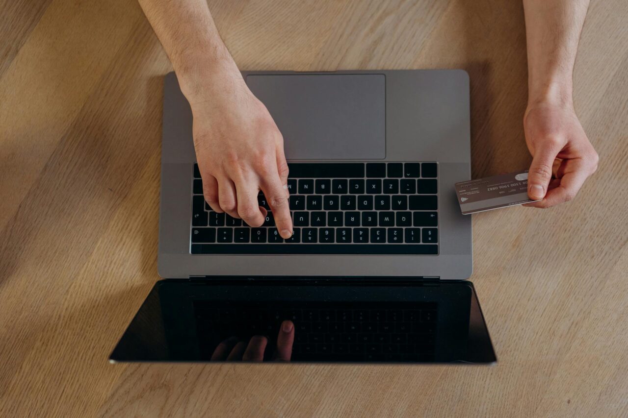 a person using a computer to order firearm parts online