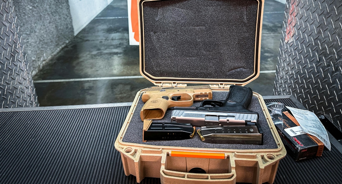 Firearm stored in a foam case inside a safe.