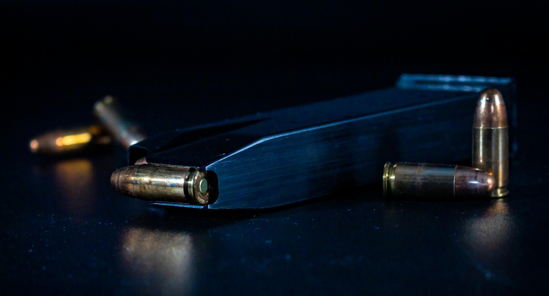 A loaded magazine on a surface.