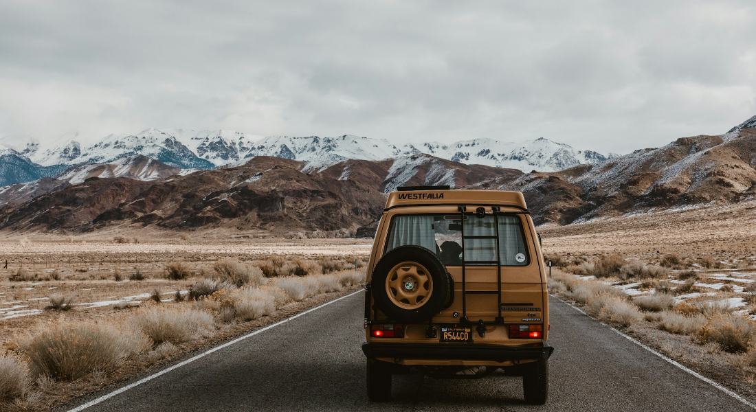 a vehicle with people going on a road trip