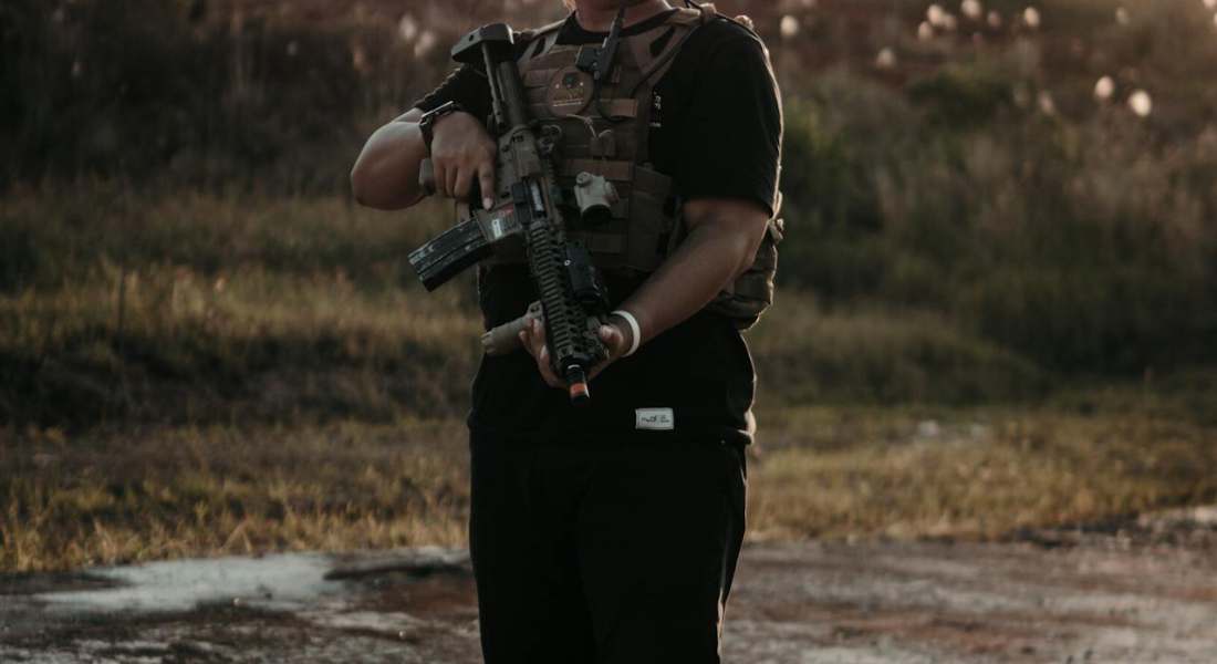 a man holding a gun examining MP5 slip trip problems