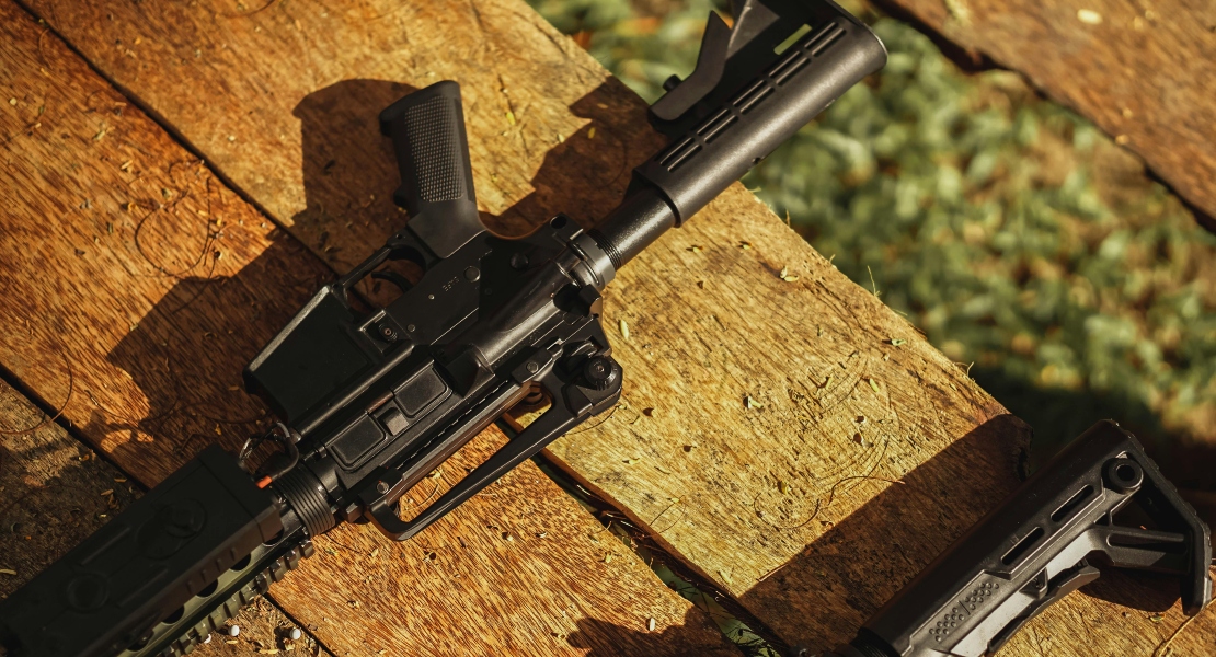 A gun on the wooden surface.