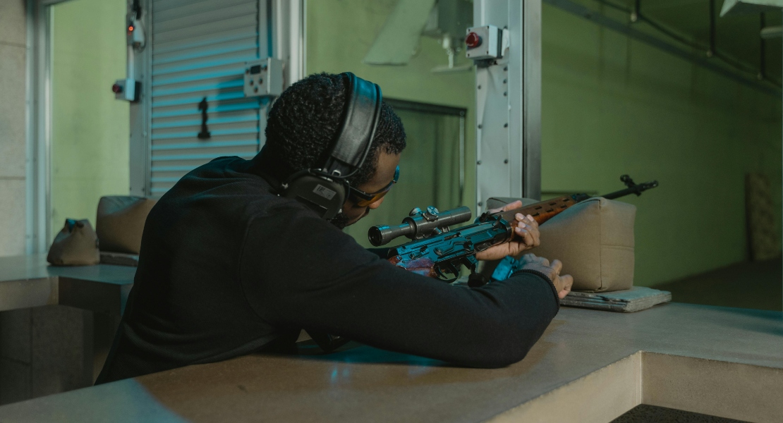 A man holding a rifle.