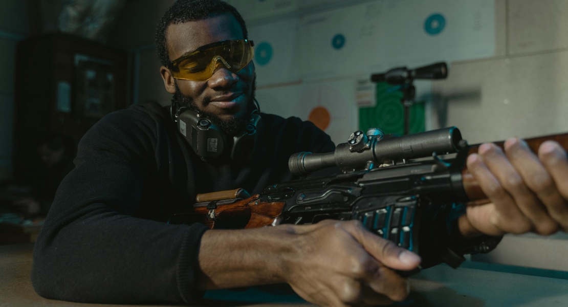 A man holding a rifle.