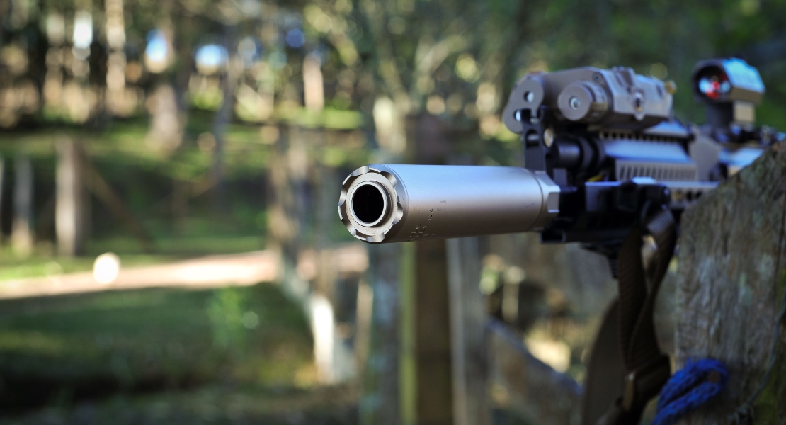 A close-up of a suppressor on an AR15.