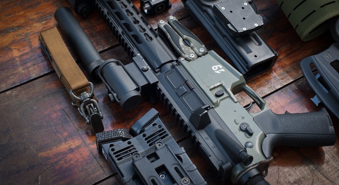 Firearms laid on a wooden table