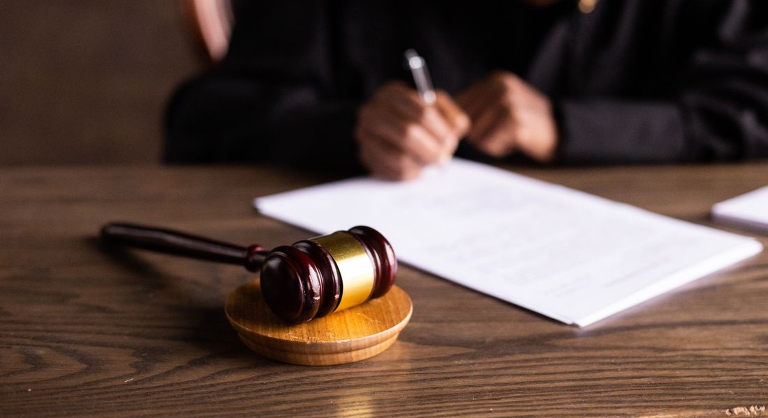 Judge signing legal paperwork