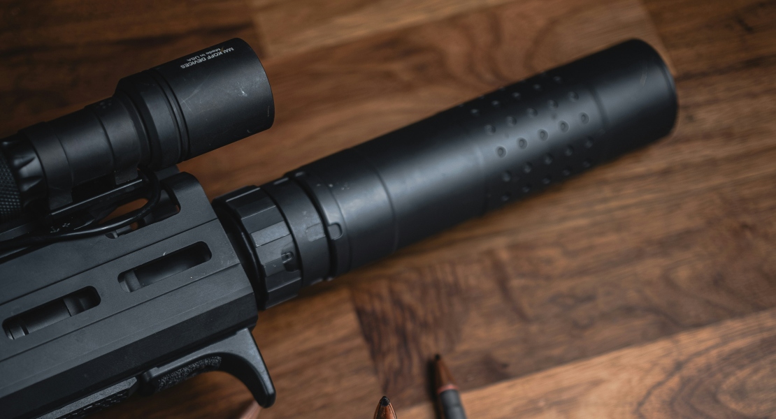 A close-up of a suppressor on an AR15 build.