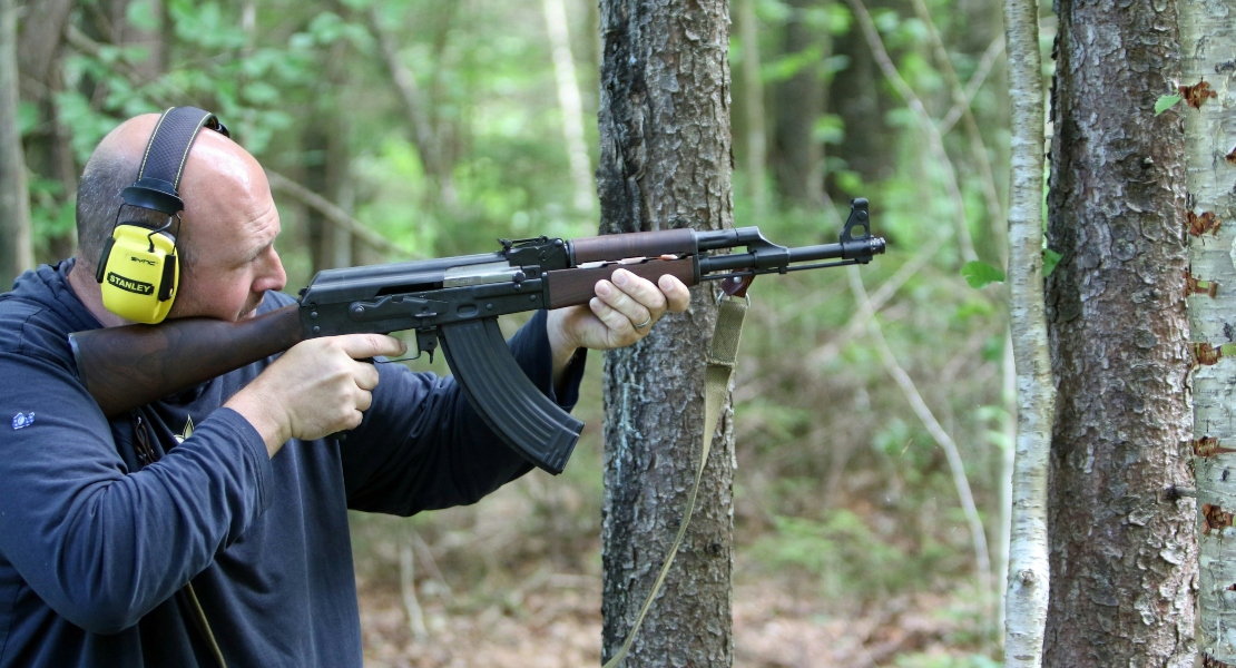 A man shooting with an AK, showing how AK became civilian rifle .