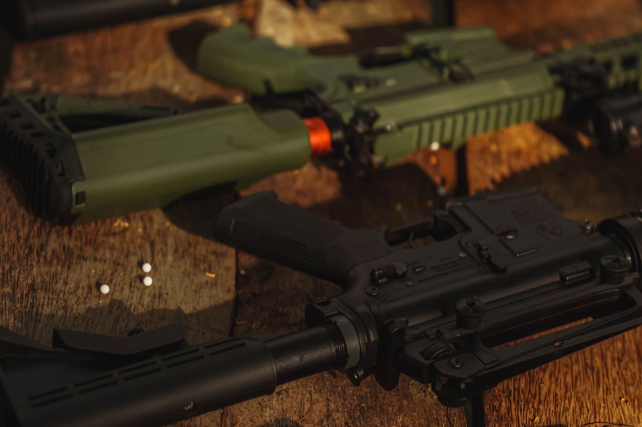 AR-15 rifles on a wooden workbench