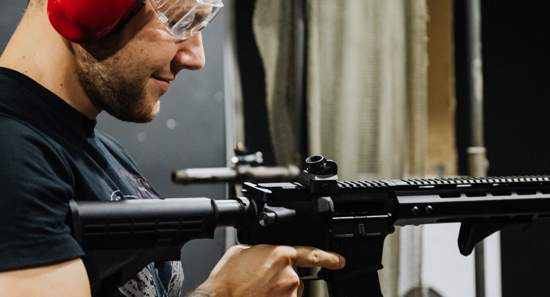 Shooter holding an AR-15 during a dead trigger super safety check