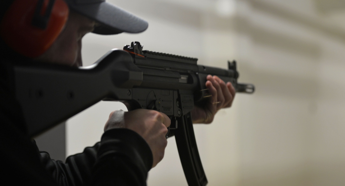 An officer holding a rifle, explainging how MP5 became law enforcement standard.