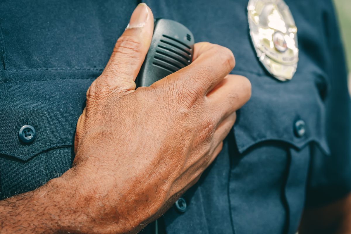 a close-up of a policeman with his radio