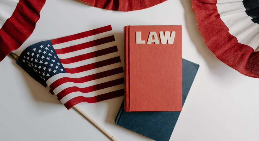 American flag with a law book