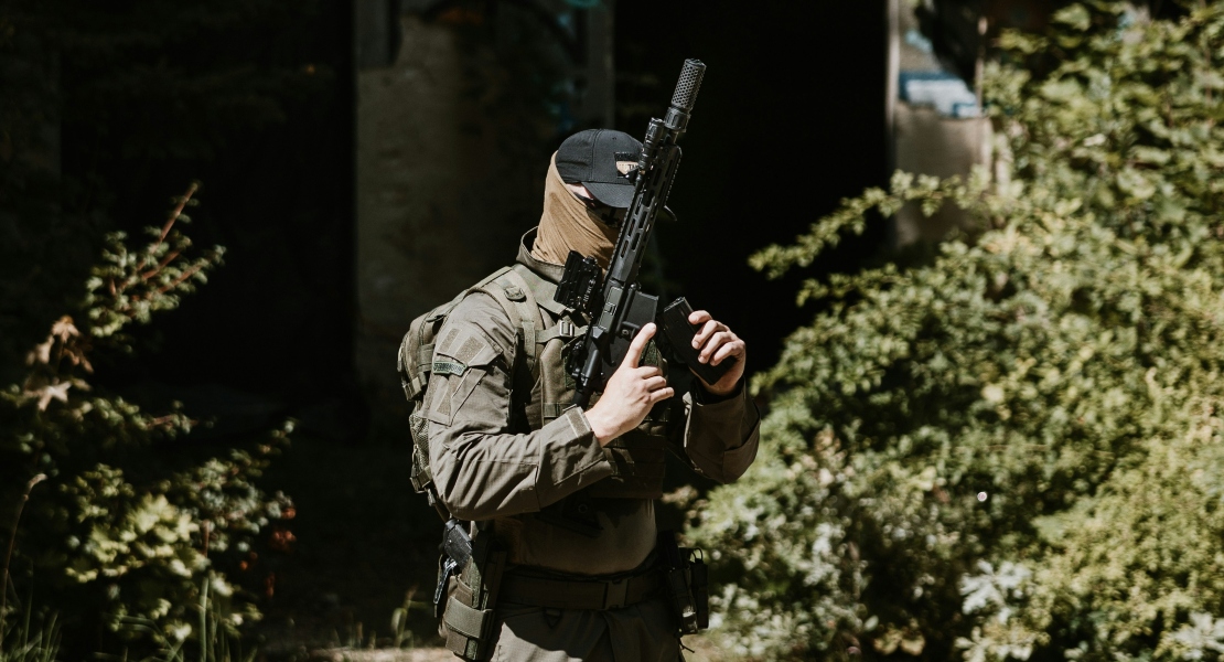 A soldier carrying a rifle.