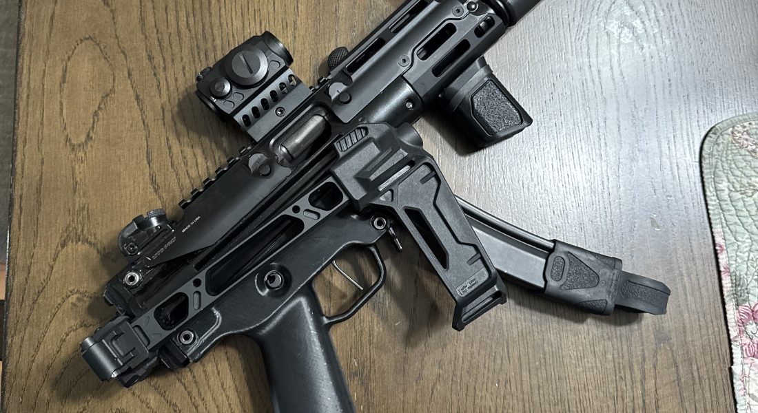 an view of an AR15 on a wooden table
