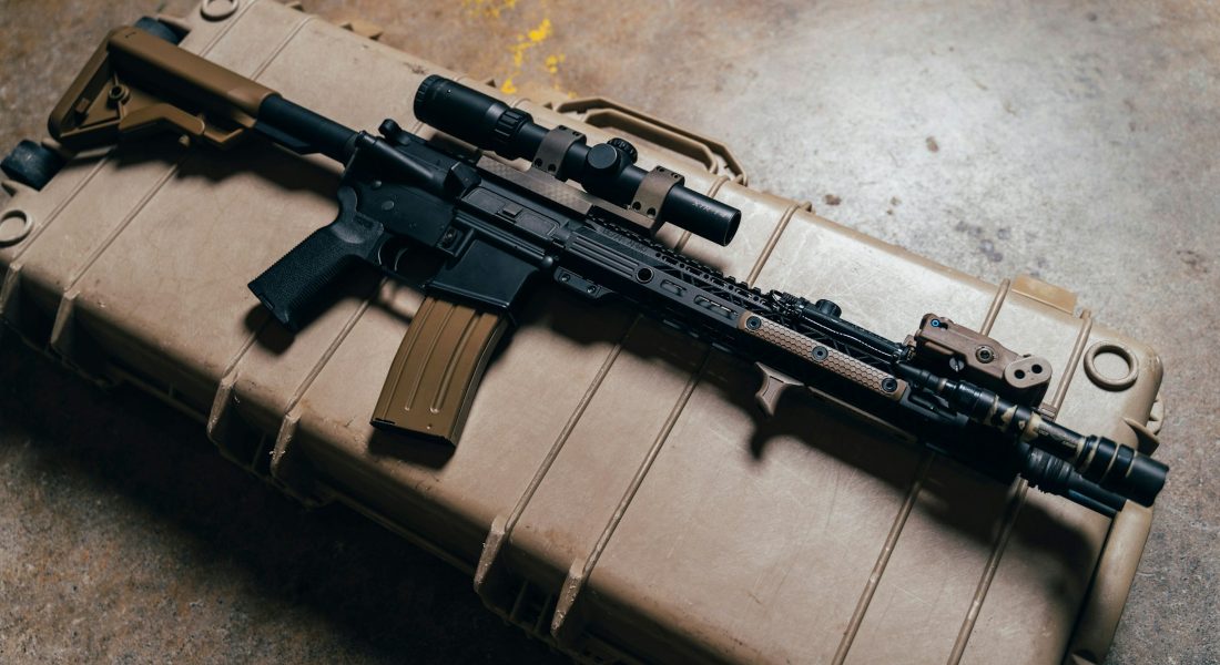 a rifle on a brown container